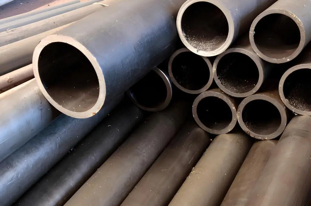 Thick-walled ferrous metal pipes